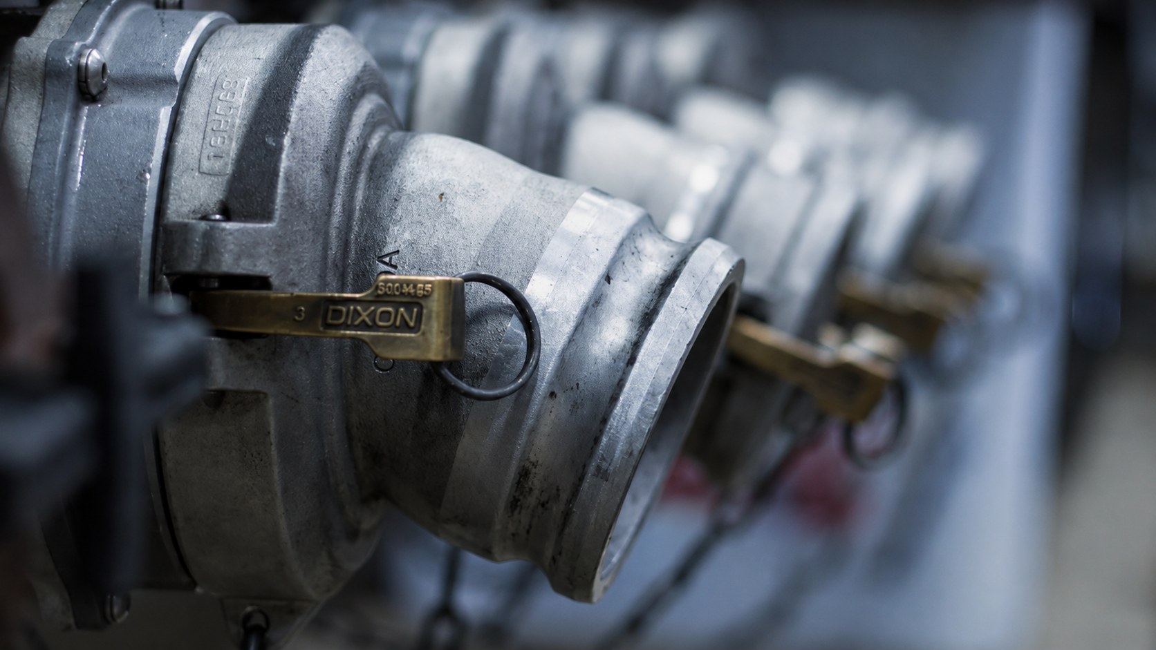 Macro detail of polished brass DIXON couplings on a J.P. McMahon fuel tanker